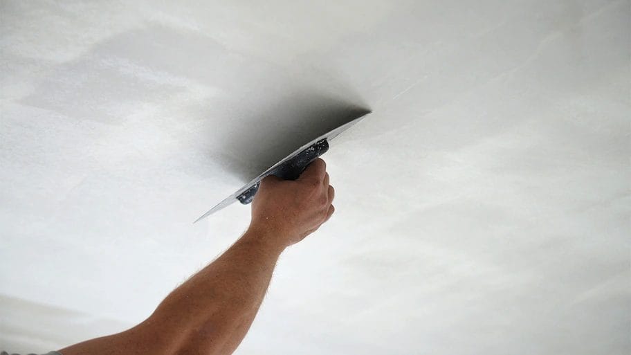 Man patching ceiling